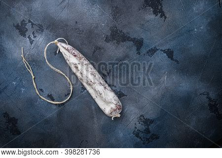 Whole Spanish Longaniza White Sausage On Blue Background, Top View With Copy Space