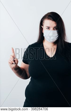 Insight. Important Information. Attention Gesture. Woman In Medical Mask And Gloves Pointing Finger 