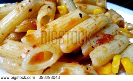 Closup Of Penne Pasta With Tomato Sauce