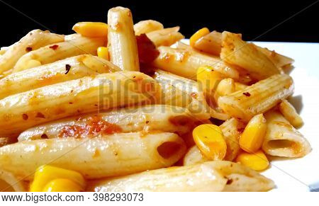 Closup Of Penne Pasta With Tomato Sauce