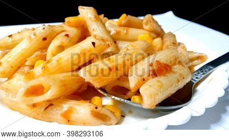 Closup Of Penne Pasta With Tomato Sauce