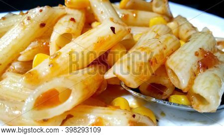 Closup Of Penne Pasta With Tomato Sauce