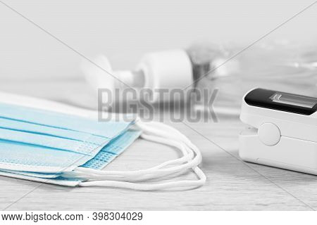 Medical Concept. Pulse Oximeter, Sanitizer And Face Masks. Pneumonia Prevention And Cure, Flu Sesion