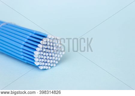 Blue Microbrushes, Small Brushes For Cleaning Eyelashes And Teeth. Blue Background. Dentistry, Eyela