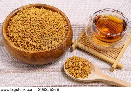 Healing Drink, Seeds, Medicinal Plant Fenugreek On A Wooden Light Table Closeup. Shambala Grains For
