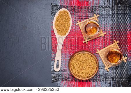 Fenugreek Seeds Or Methidana Drink By Speaking It In Water Overnight. Close Up. Flat Lay. Copyspase