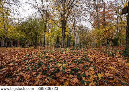 View Of Famous Old North Cemetery Of Munich, Germany With Historic Gravestones. Funerals Have Not Be