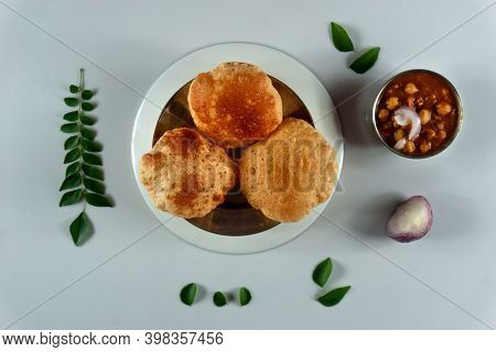 Delicious And Tasty Homemade Poori Placed On A Plate With White Background