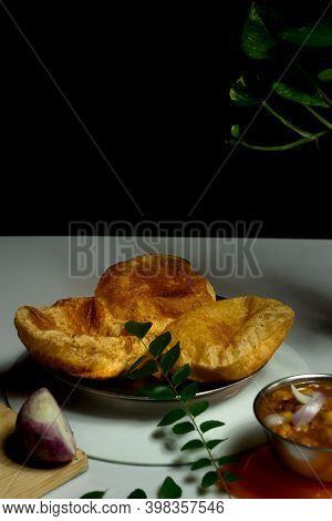 Delicious And Tasty Homemade Poori Placed On A Plate With Black And White Background