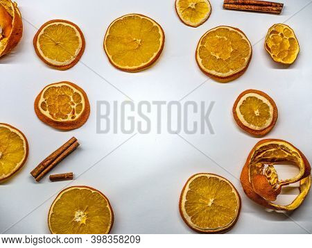 White Background With Oranges And Cinnamon Slaces