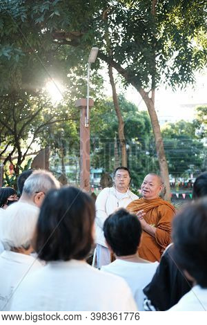 Buddhist Monk Teaching Dhamma To People