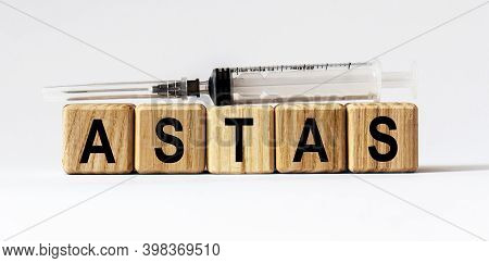 Text Astas Made From Wooden Cubes. White Background