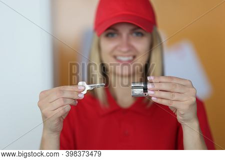 Woman Hold Door Lock And Key In Hand. Business And Services For Safe Opening And Replacement Of Door