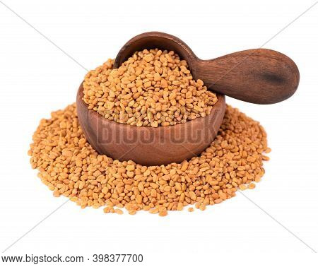 Fenugreek Seeds In Wooden Bowl And Spoon, Isolated On White Background. Shambala, Helba Seeds.