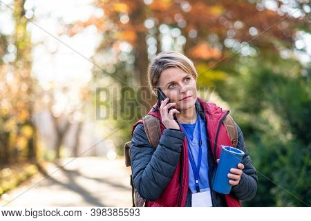 Woman Caregiver, Nurse Or Healthcare Worker Outdoors On The Way To Work, Coronavirus Concept.