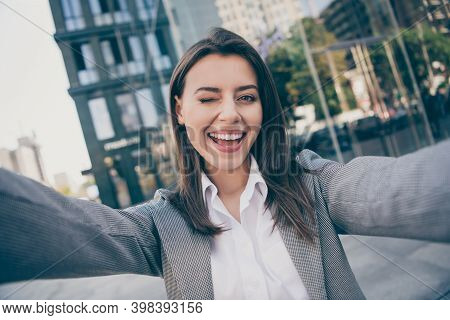 Photo Of Happy Cheerful Attractive Young Businesswoman Take Selfie Wink Eye Outside In Outdoors Cent