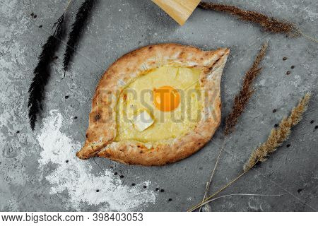 Khachapuri In Adjarian. Open Pie With Mozzarella And Egg. Georgian Cuisine