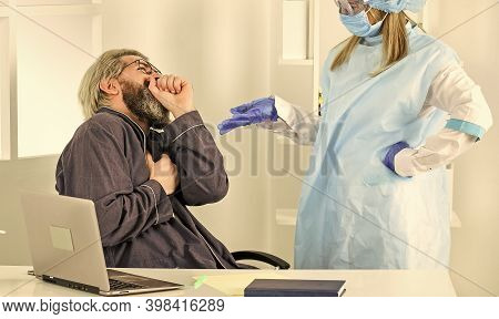 Coronavirus Symptoms. Doctor Protective Equipment Examines Male Patient Suspected Coronavirus Infect