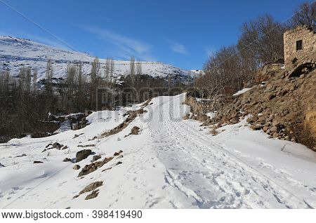 Snowy Village Road With Blue Winter Sky In Nigde,turkey
