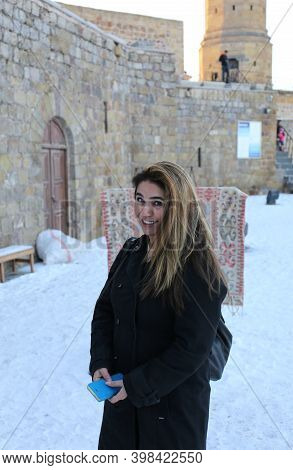 Nigde,turkey-january 15:unidentified Pretty Tourist Woman Visiting Nigde Castle.january 15,2017 In N