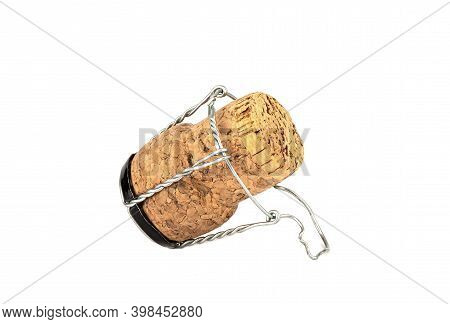 Champagne Cork With Muselet On A White Background. Copy Space.