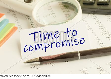 Paper With Word Time To Compromise On A Table, Concept