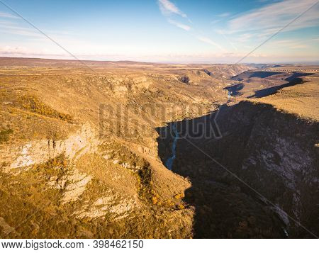 Birds Eye View To Historical Fortified City Ruins On Scenic Cliff Surounded By Canyos And Khrami Riv