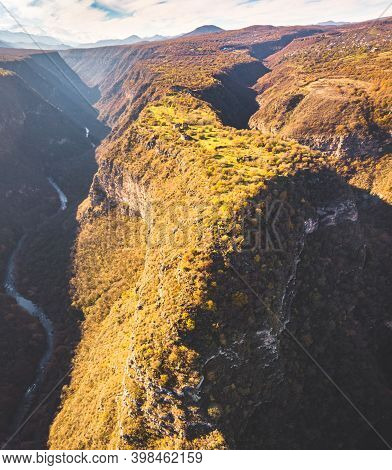 Birds Eye View To Historical Fortified City Ruins On Scenic Cliff Surounded By Canyos And Khrami Riv