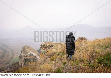 Woman Is Standing On The Edge Of Historical Site Of Chapala Fortress. Sightseeing In Georgia.