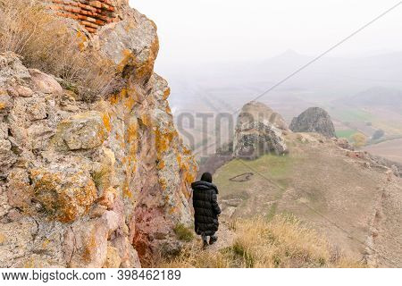 Woman Is Standing On The Edge Of Historical Site Of Chapala Fortress. Sightseeing In Georgia.