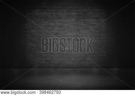 Black Brick Wall With Vignette. Studio Backdrop - Well Use As Back Drop Background.
