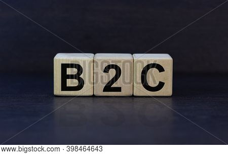 B2c Symbol. Concept Word 'b2c - Business To Customer' On Cubes On A Beautiful Dark Wooden Background