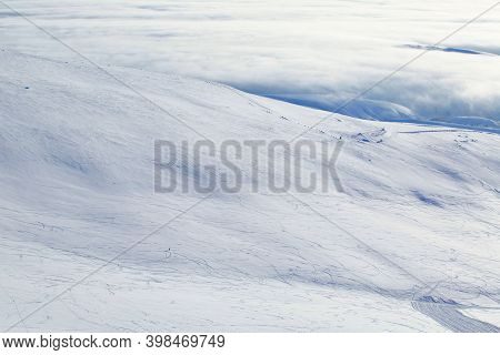 Male Freeride Skier In Northern Mountains In Lapland At Sunny Day Riding Off Piste Far Away View