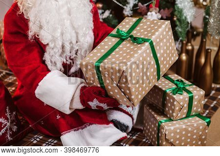 Boxes With Gifts In The Hands Of Santa Claus.