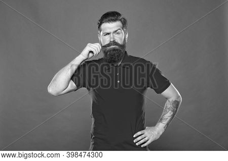 Occupy Upper Lip. Bearded Man Twirl Moustache Red Background. Hipster Wear Long Beard And Moustache.