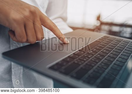 The Finger's Businessman Use Trackpad On Laptop.