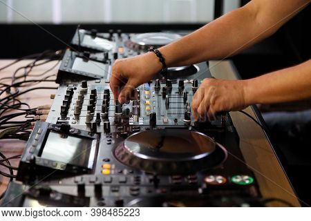 Playing Music With Dj Mixer Controller. Selective Focus.