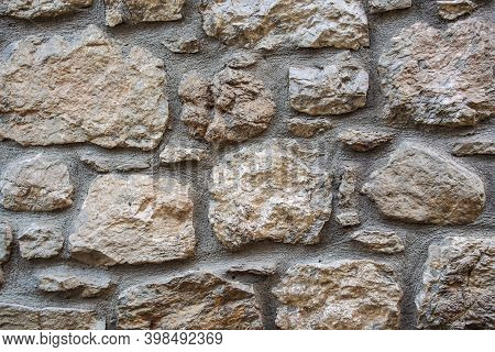Stone Wall Of Large Stones. Rustic Grey Stone Wall Texture. Part Of A Stone Wall, For Background Or 