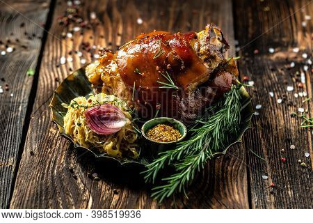 Traditional German Cuisine, Schweinshaxe Roasted Ham Hock, Bavarian Grilled Pork Knuckle With Sauerk
