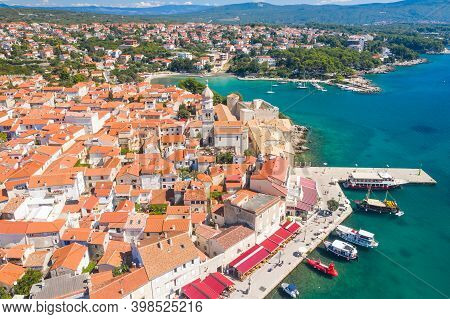 Panoramic View Of The Old Town Of Krk In Croatia, Cathedral Tower And Seascape In Background