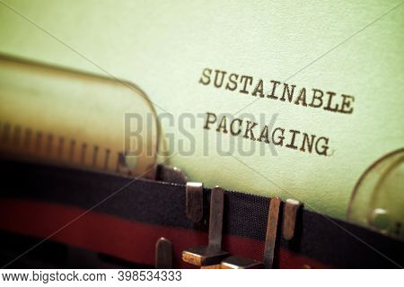 Sustainable packaging phrase written with a typewriter.