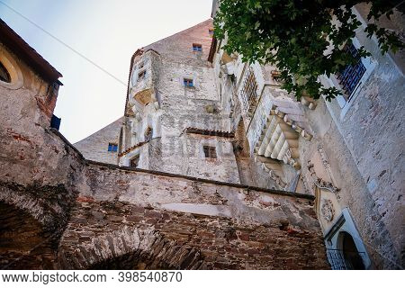 Gothic Imposing Historic Castle Pernstejn At Sunny Summer Day, Stronghold On Rock Above Village Of N