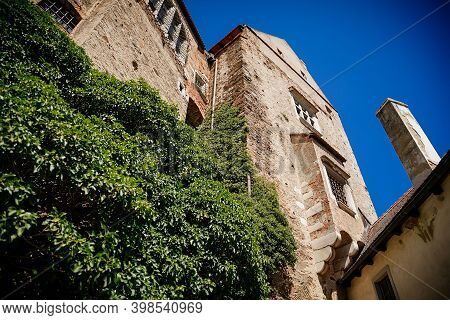 Gothic Imposing Historic Castle Pernstejn At Sunny Summer Day, Stronghold On Rock Above Village Of N