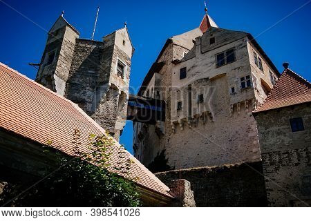Gothic Imposing Historic Castle Pernstejn At Sunny Summer Day, Stronghold On Rock Above Village Of N
