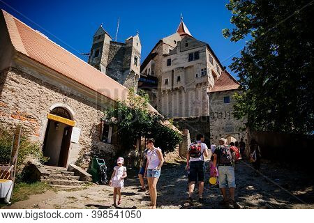 Gothic Imposing Historic Castle Pernstejn At Sunny Summer Day, Stronghold On Rock Above Village Of N