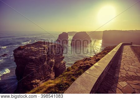 Rocky Sea Coast At Sunrise. Playa De Las Catedrales, Ribadeo, Spain, Europe