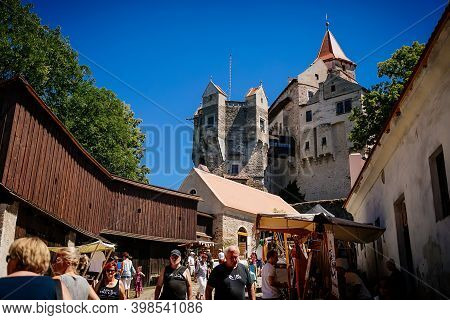 Gothic Imposing Historic Castle Pernstejn At Sunny Summer Day, Stronghold On Rock Above Village Of N