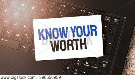 White Paper Sheet With Text Know Your Worth On The Black Laptop