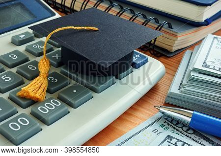 Student Loan Concept. Graduation Cap On The Calculator.