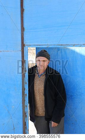 Nigde,turkey-january 15:unidentified Man Coming Out From Metal Blue Door.january 15,2017 In Nigde,tu